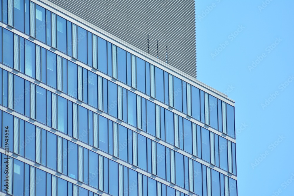 Abstract fragment of contemporary architecture, walls made of glass and concrete. Glass curtain wall of modern office building Abstract fragment of contemporary architecture, walls made of glass and concrete. Glass curtain wall of modern office building