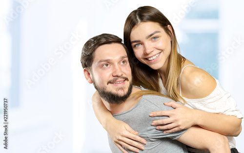 Happy Smiling Couple in love indoors portrait