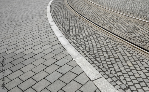 Traces of tram tracks on the road.