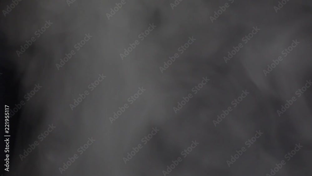Abstract cloud White smoke slowly floating through space against black background. Fog effect Smoke machine Abstract cloud White smoke slowly floating through space against black background. Fog effect Smoke machine