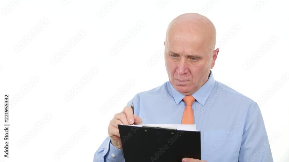 Businessman Write Financial Information in a Clipboard Businessman Write Financial Information in a Clipboard