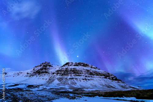 Kirkjufell and Aurora in Iceland. photo