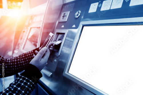 finance, money, bank and people concept - close up of hand entering pin code at atm machine