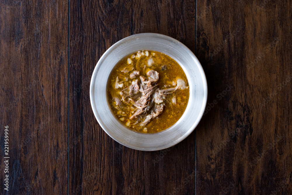 Turkish Soup Beyran with Lamb Meat, Rice, Chopped Garlic and Vinegar Sauce Served with Salad. Turkish Soup Beyran with Lamb Meat, Rice, Chopped Garlic and Vinegar Sauce Served with Salad.