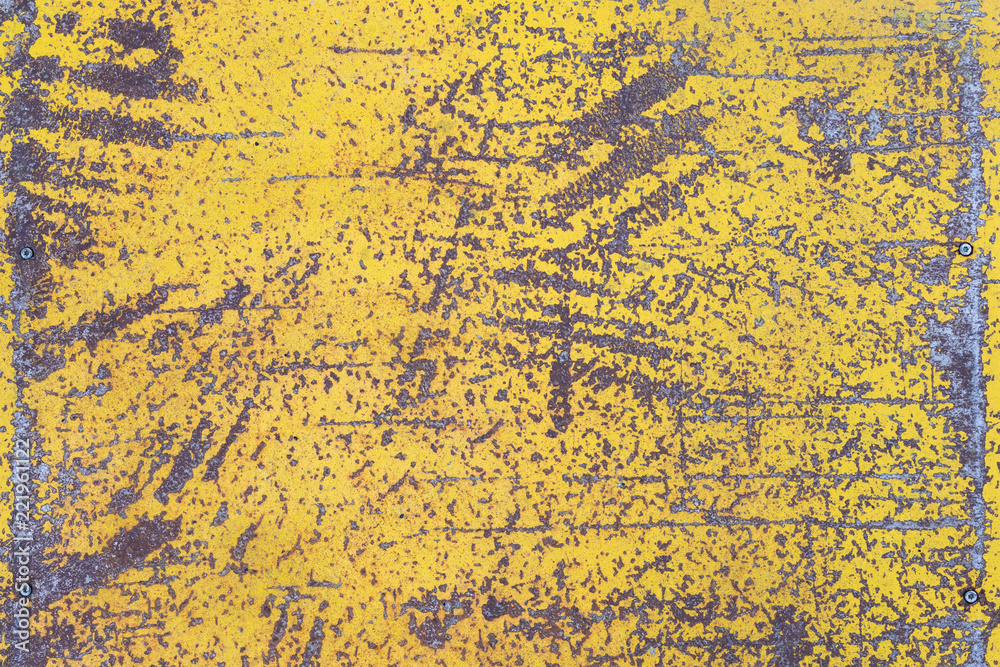 Worn yellow paint on metal sheet texture background