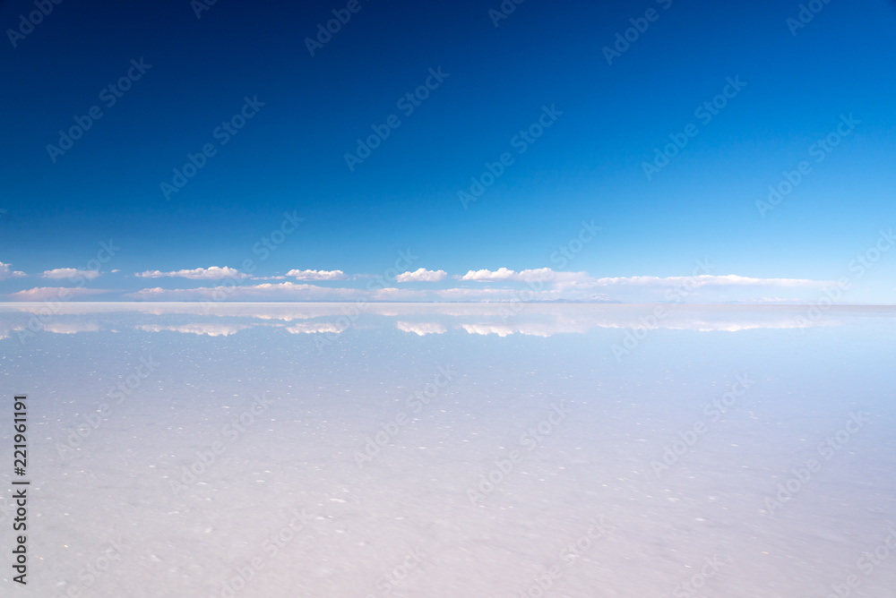 Miror effect and reflection of clouds in Salar de Uyuni (Uyuni salt flats), Potosi, Bolivia, South America