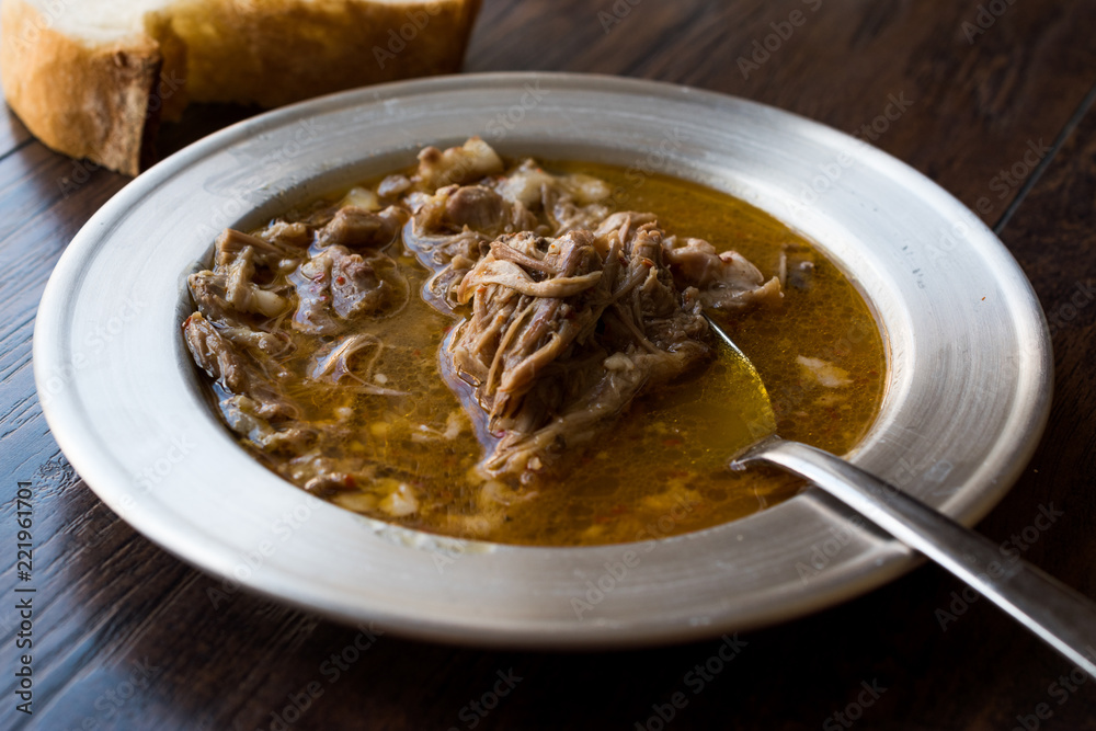 Turkish Soup Beyran with Lamb Meat, Rice, Chopped Garlic and Vinegar Sauce Served with Salad. Turkish Soup Beyran with Lamb Meat, Rice, Chopped Garlic and Vinegar Sauce Served with Salad.