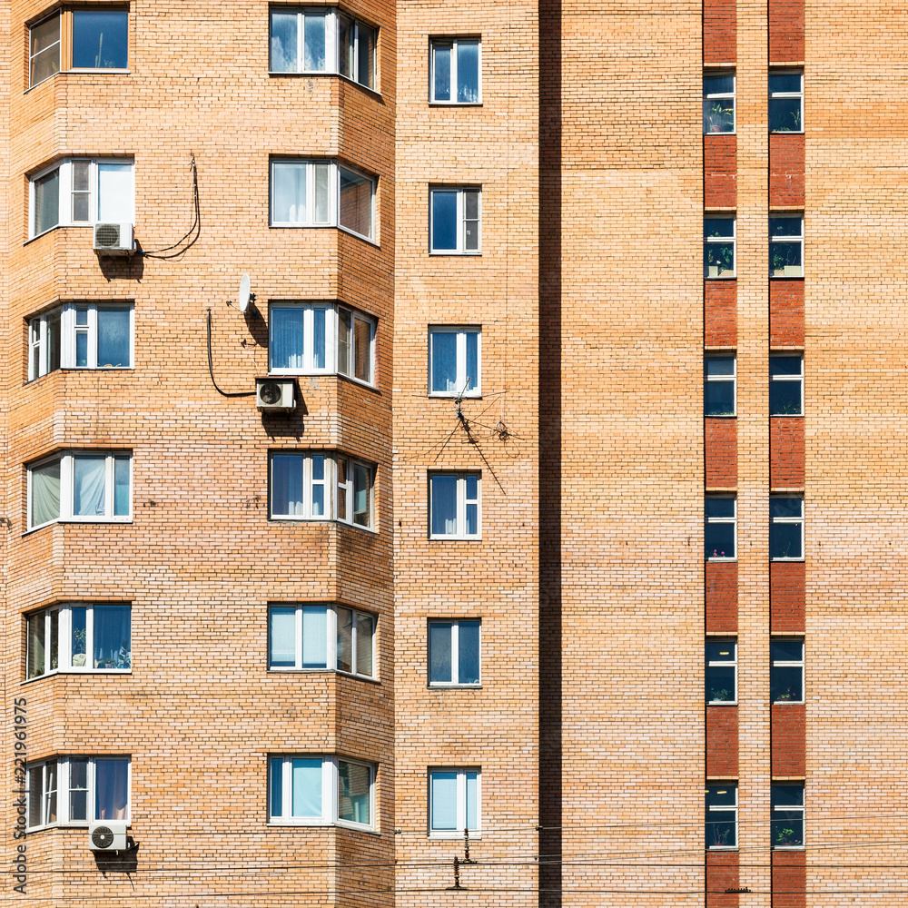 Obraz premium detail of facade of urban brick apartment building