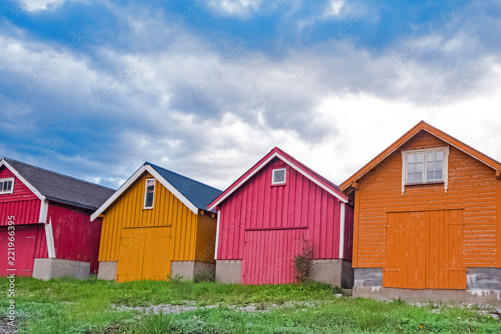 Colorful wooden houses standing next to each other. Colorful wooden houses standing next to each other.