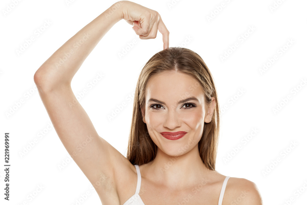 Beautiful happy girl scratches her head on white background Beautiful happy girl scratches her head on white background