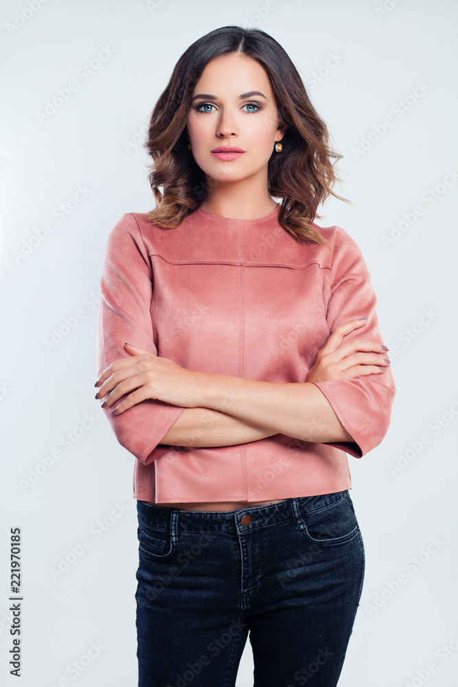 Young successful woman in casual clothes. Girl with arms crossed Young successful woman in casual clothes. Girl with arms crossed