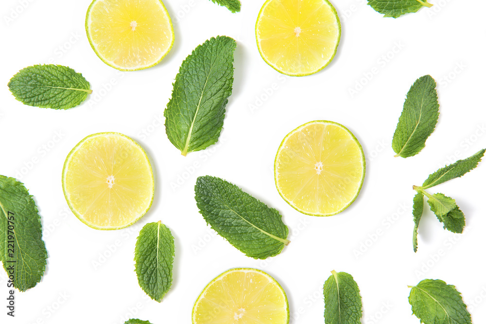 Ripe lime slices and mint leaves pattern isolated on white background, top view Ripe lime slices and mint leaves pattern isolated on white background, top view