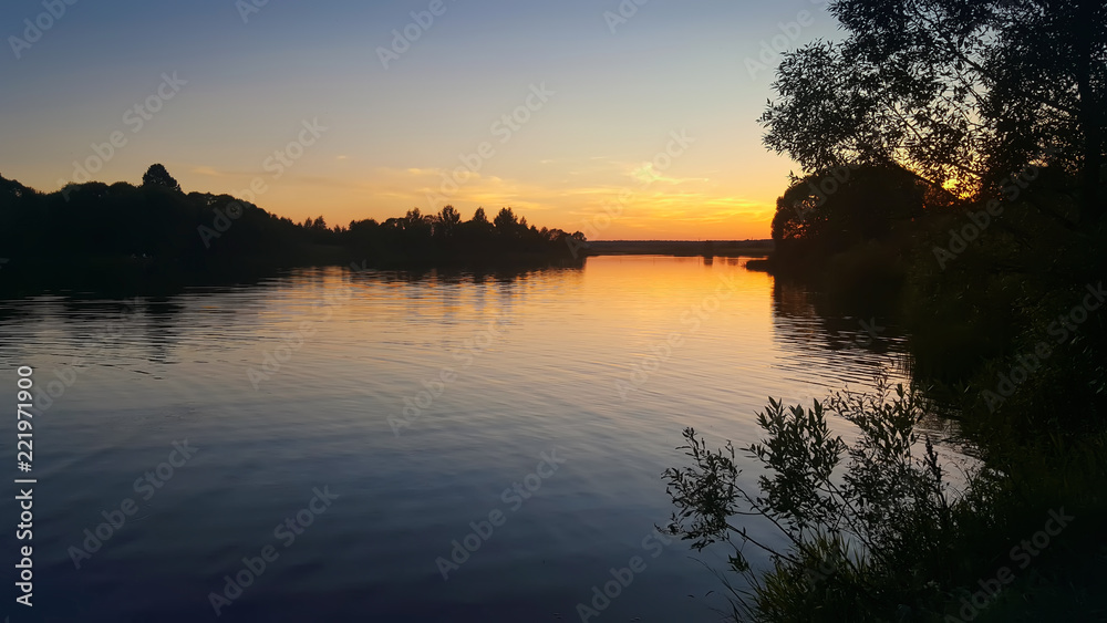 Obraz premium Beautiful sunset on the river 