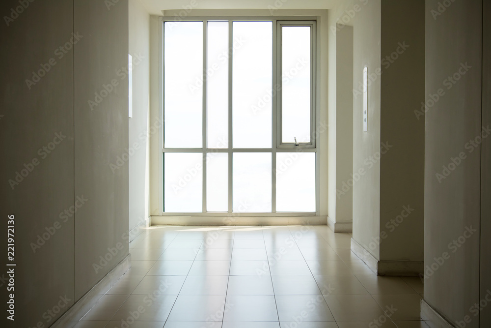 Fototapeta premium image of windows in modern office building.empty long corridor in the modern office building.