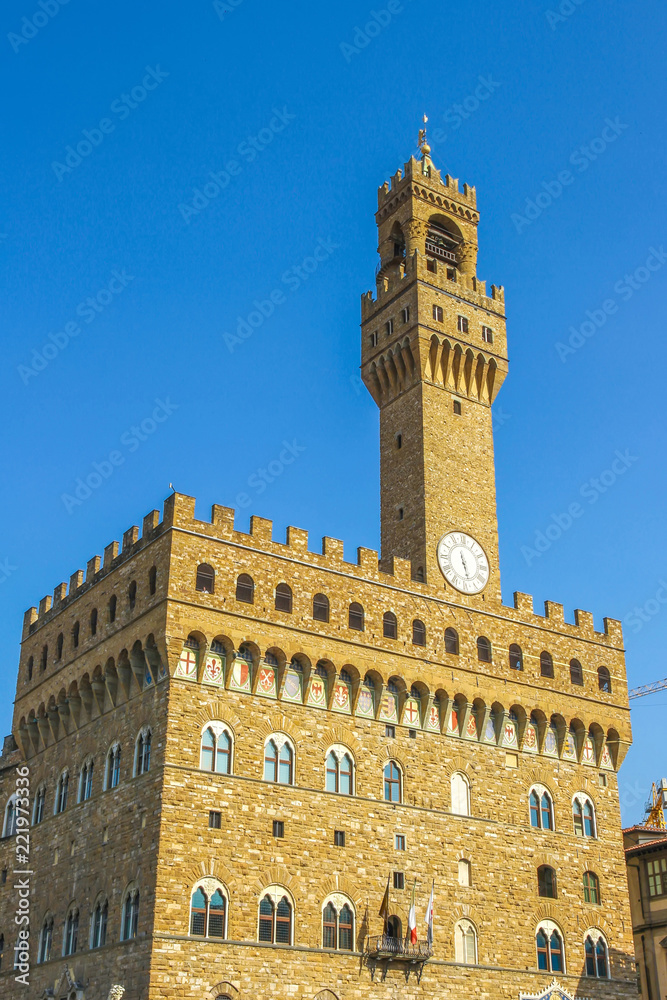 View on the old palace called Palazzo Vecchio in Florence, Italy on a sunny day.