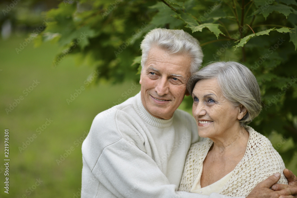 Portrait of elderly couple together in park Portrait of elderly couple together in park