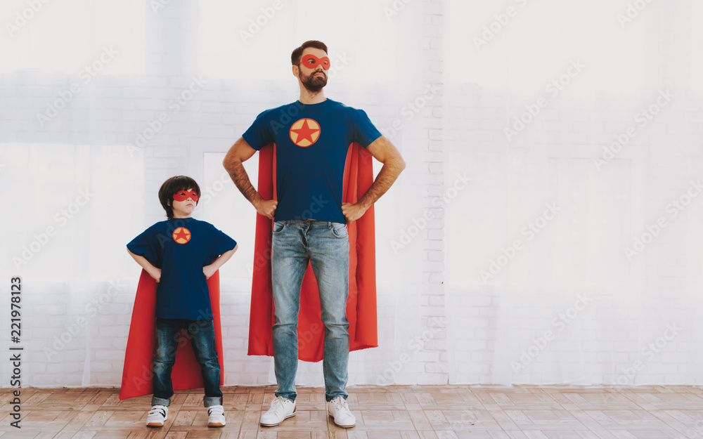 Father And Son In Superhero Suits. Family Concept. - obrazy, fototapety, plakaty 