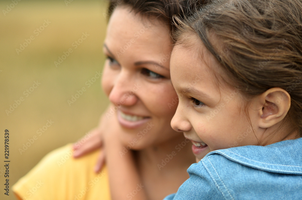 Portrait of mother and daughter at field Portrait of mother and daughter at field