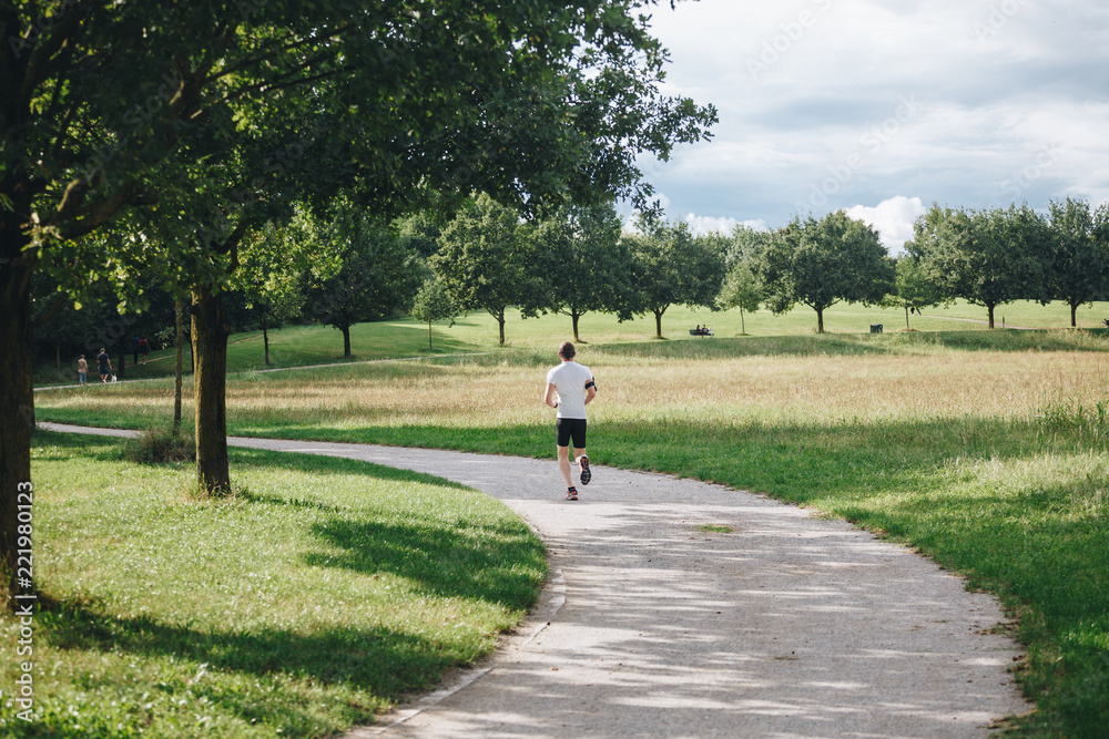 Man practicing jogging at the north park in Milan Man practicing jogging at the north park in Milan