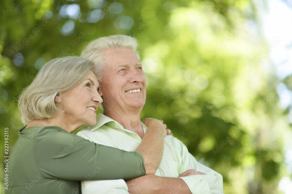 Portrait of happy mature couple in park