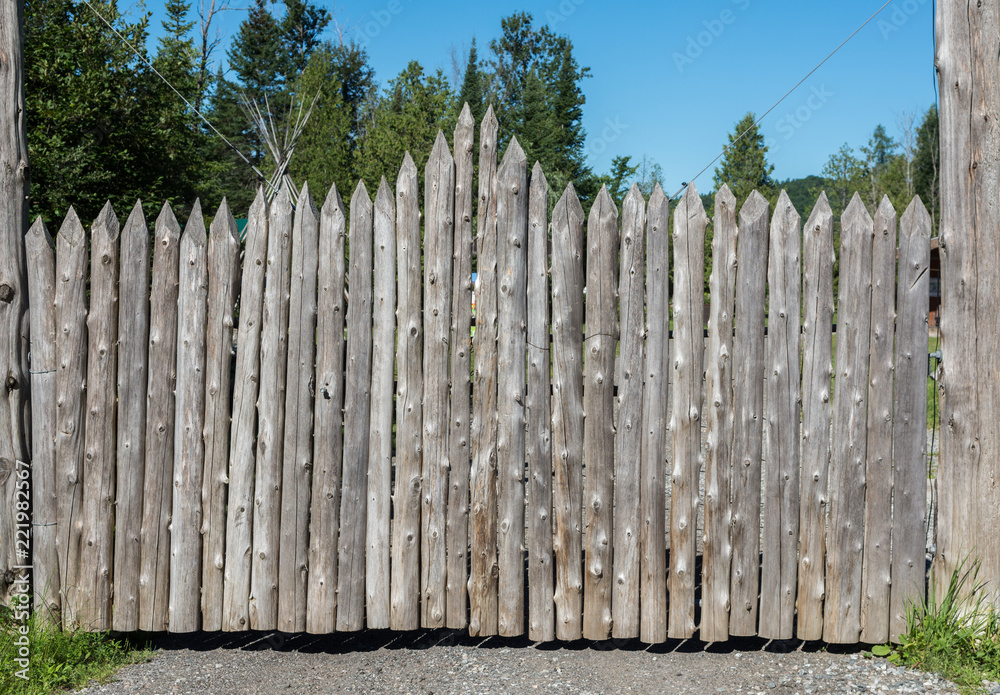 Wooden gates made of sharpened logs
