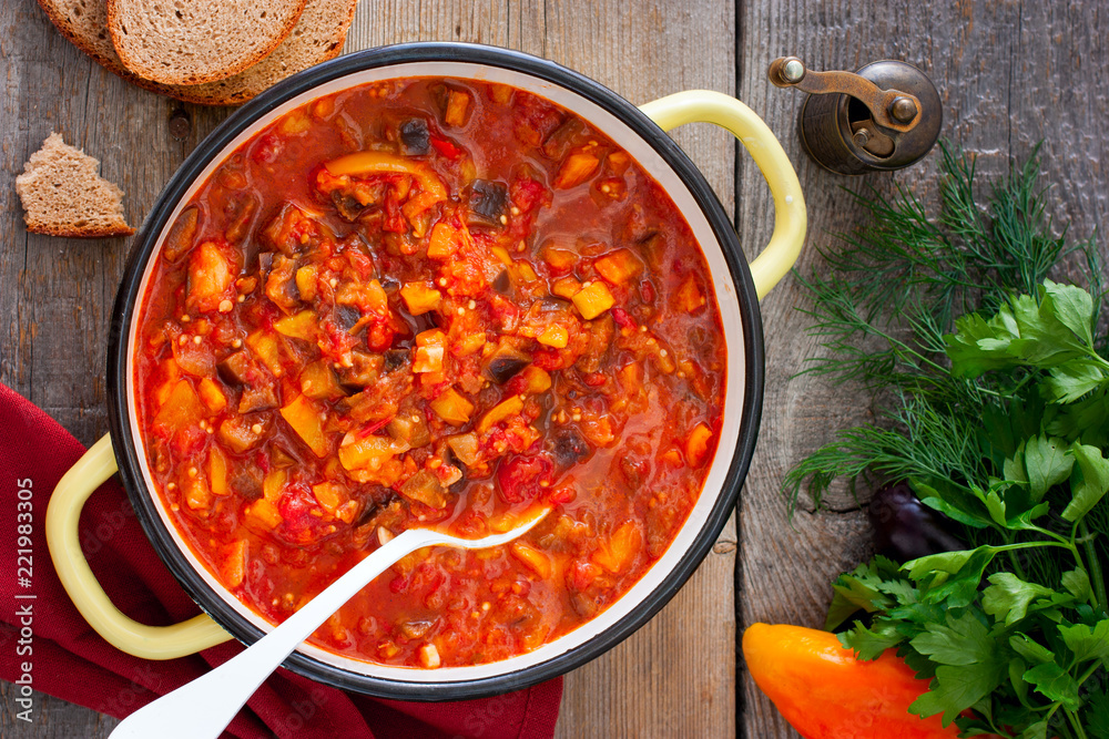 Vegetable gyuvech, a traditional dish for Moldovan, Romanian, Bulgarian cuisine, top view, selective focus Vegetable gyuvech, a traditional dish for Moldovan, Romanian, Bulgarian cuisine, top view, selective focus
