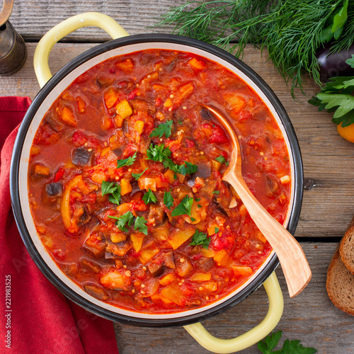 Vegetable gyuvech, a traditional dish for Moldovan, Romanian, Bulgarian cuisine, top view, selective focus photo