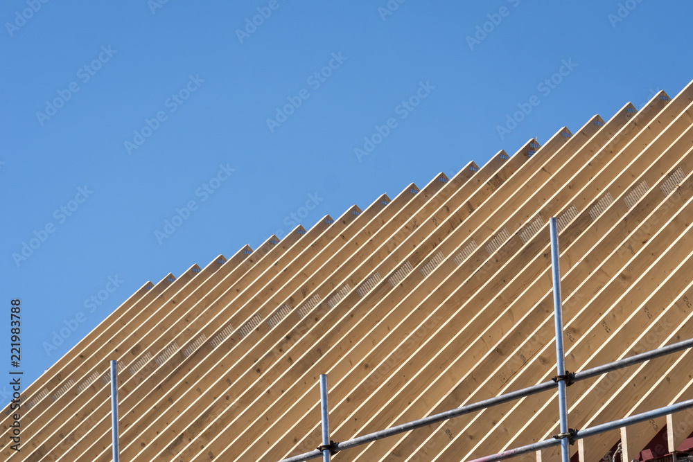 roof trusses on a new building against blue sky roof trusses on a new building against blue sky