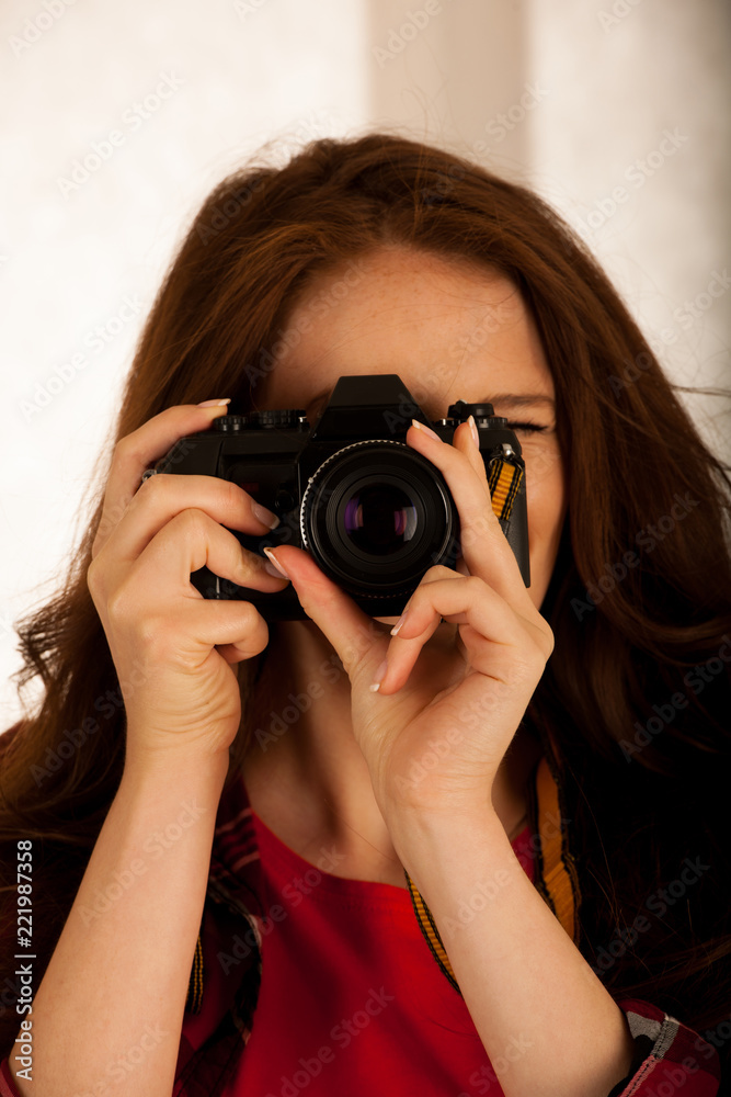 attractive beautiful woman holding a retro camera attractive beautiful woman holding a retro camera