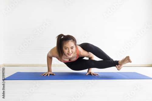Asian sport girl practise herself in yoga classroom.
