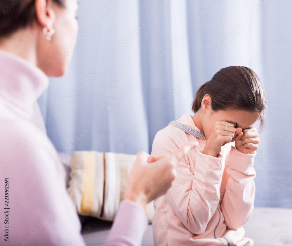 Fototapeta premium Mother reprimands her daughter