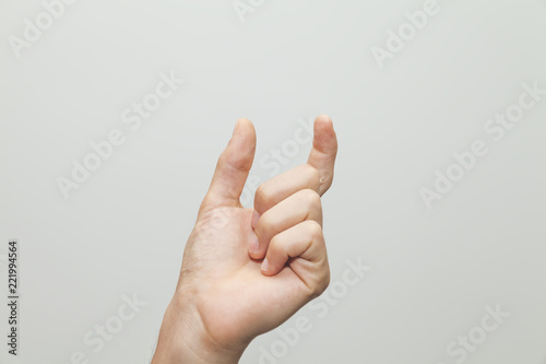  Male hand gesturing a small amount