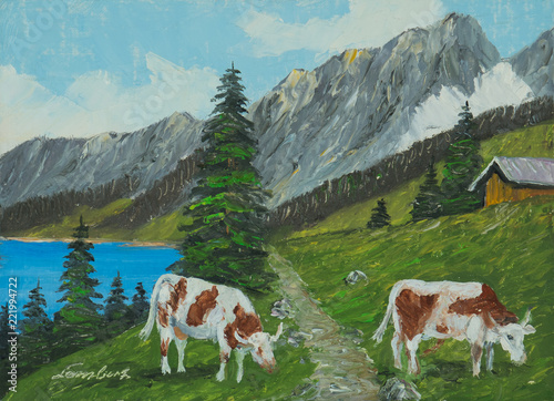Berglandschaft mit See und Kühen im Vordergrund