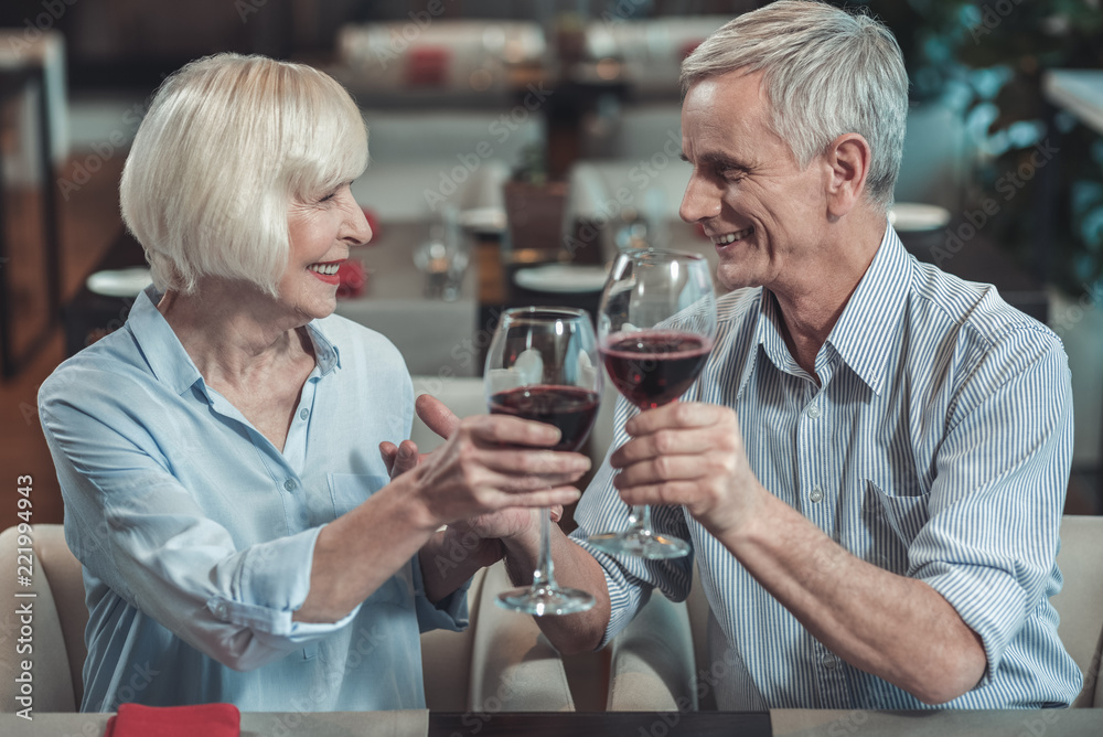 Eye to eye. Joyful male person feeling happiness while celebrating anniversary with his woman Eye to eye. Joyful male person feeling happiness while celebrating anniversary with his woman