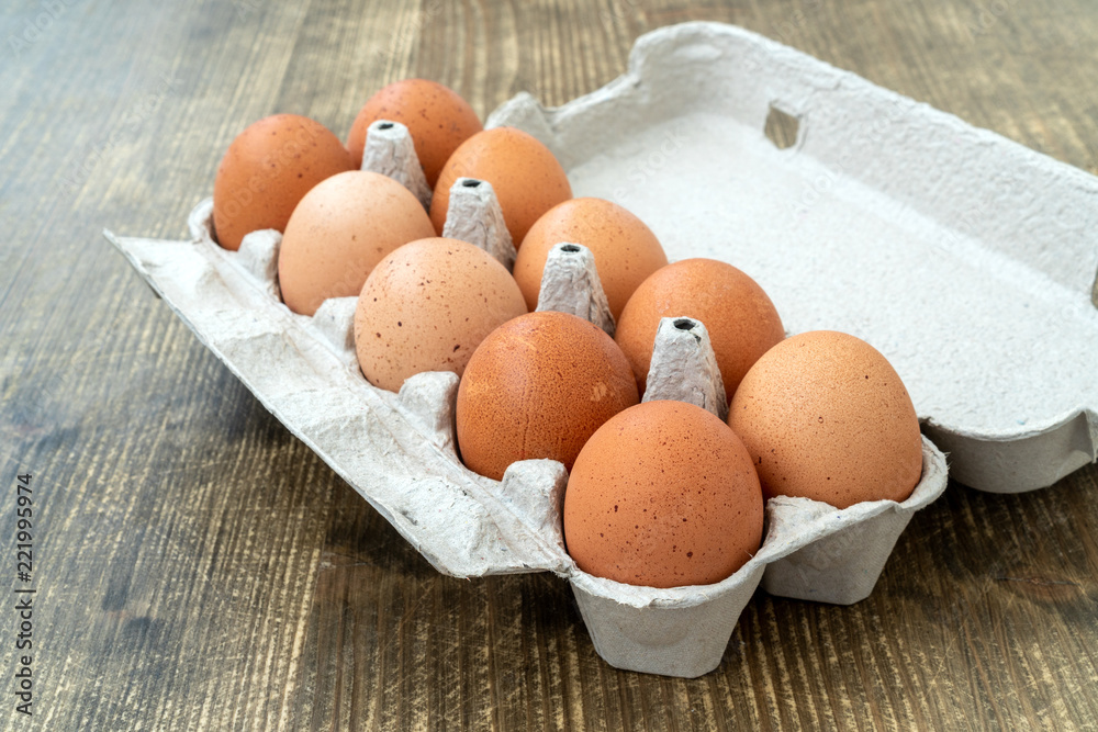 Raw chicken eggs in egg box Raw chicken eggs in egg box