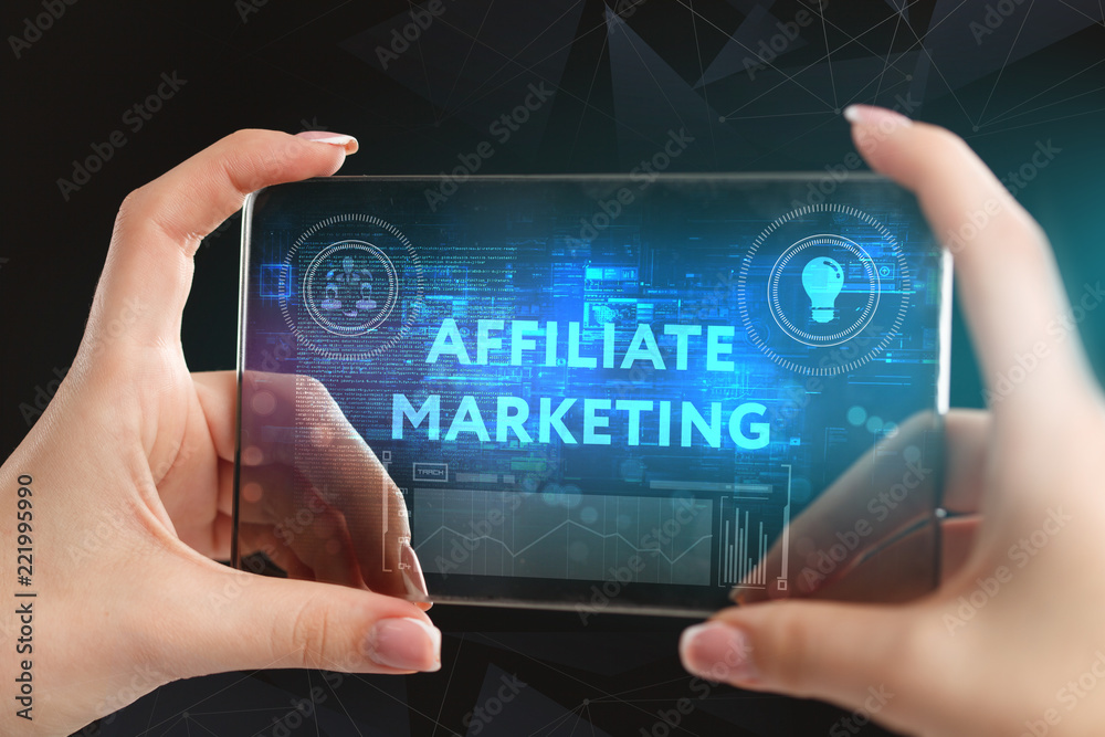 Obraz premium The concept of business, technology, the Internet and the network. A young entrepreneur working on a virtual screen of the future and sees the inscription: Affiliate marketing
