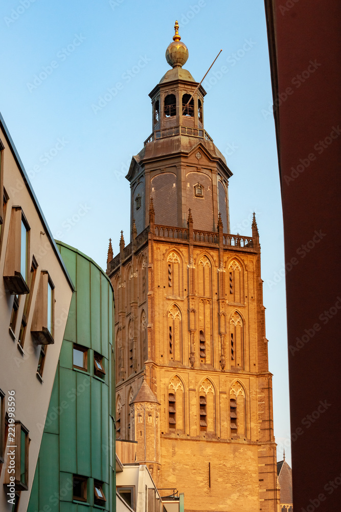 Modern architecture of town hall in contrast with historic church tower of the Walburgiskerk in Zutphen. Historic old fortified town in the Netherlands 