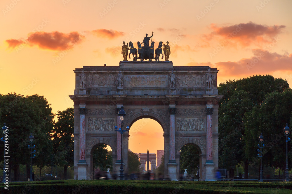 The Arc de Triomphe du Carrousel at sunset in Paris, France