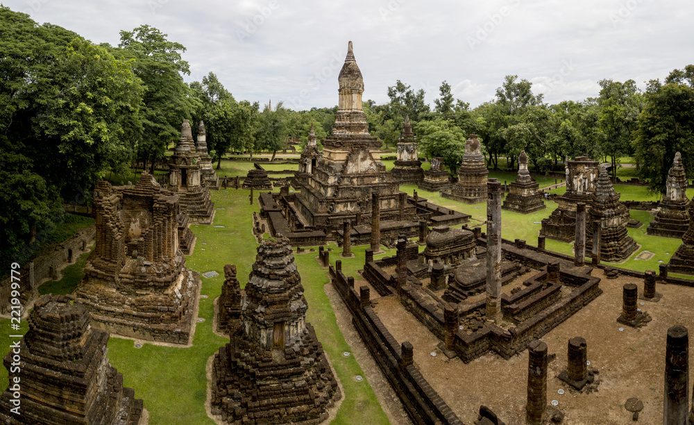 Aerial View of a historical sites ruins Buddhist Temple Wat Mahathat at The Sukhothai Historical Park, a registered UNESCO World Heritage City in the tranquil late afternoon sun