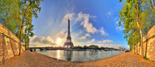 Beautiful 180 degree HDR panorama at sunrise in spring of the Eiffel tower at the river Seine in Paris, France