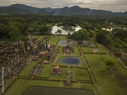 Aerial View of a historical sites ruins Buddhist Temple Wat Mahathat at The Sukhothai Historical Park, a registered UNESCO World Heritage City in the tranquil late afternoon sun