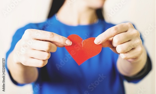 Foto Female Hands Holding a Broken Heart