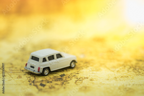 Transportation and travel concept. Miniature car toy model on world map. photo