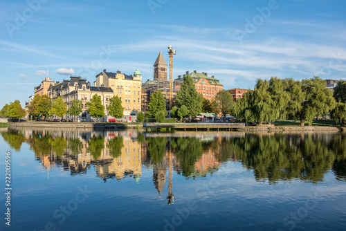 Norrk  ping waterfront and Motala river on a quiet Sunday evening in early September. Norrkoping is a historic industrial town in Sweden.