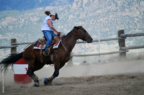 Girl Gallops Horse at Rodeo