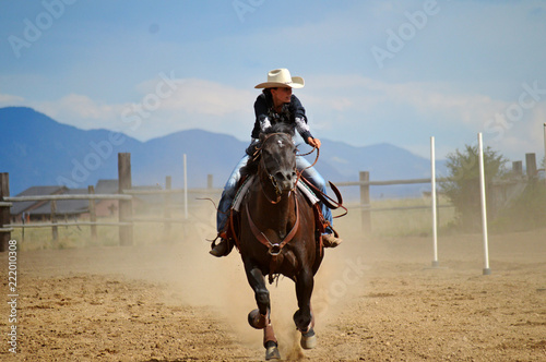 Woman Gallops in Dusty Rodeo