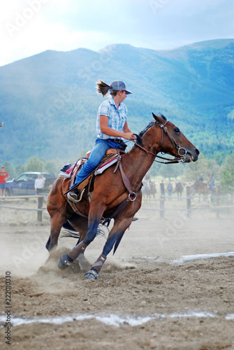 Girl horseback riding action shot