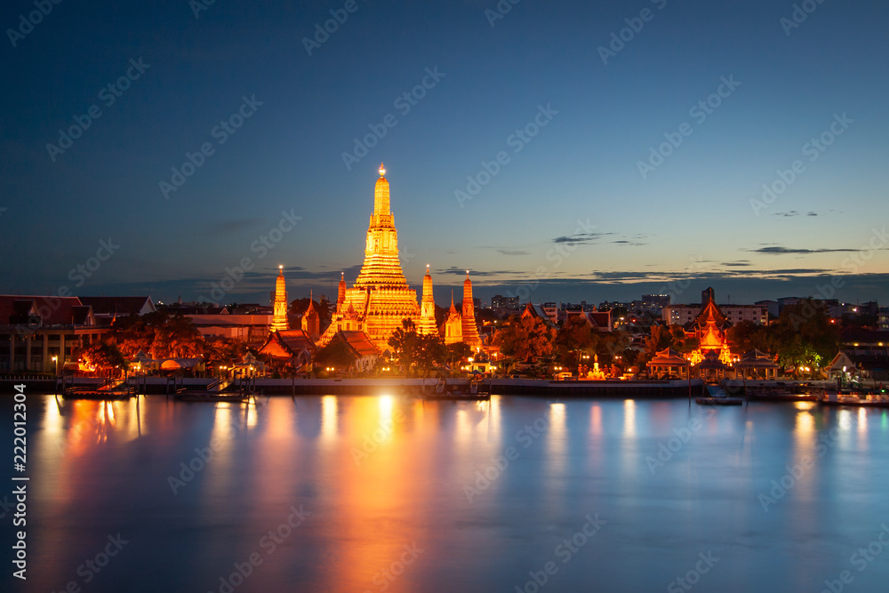 Wat Arun across Chao Phraya River during sunset in Bangkok, Thailand