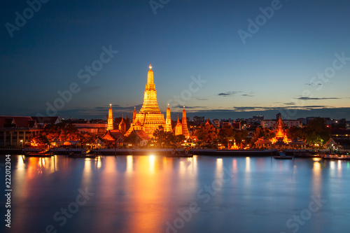Wat Arun across Chao Phraya River during sunset in Bangkok, Thailand