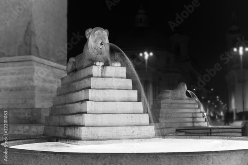 beautiful fountain shaped like a lion in Piazza del Popolo. photo